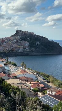 Breathtaking panoramic view of Castelsardo medieval town with Doria castle and turquoise sea, Sardinia, Italy