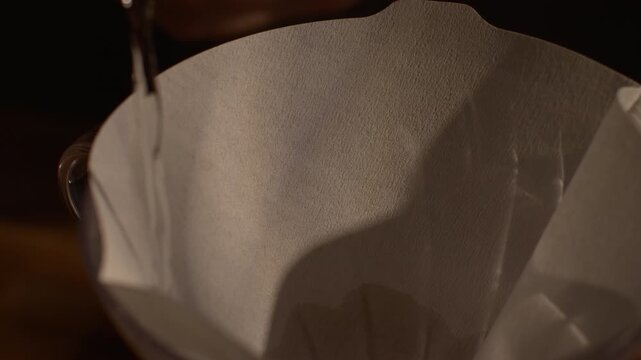Macro Pour Over Coffee Preparation, Hot Water Wetting Paper Filter in Chemex, Slow Motion, Specialty Coffee Brewing Detail