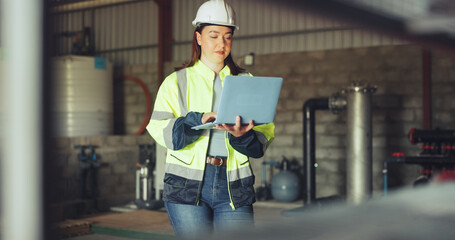 Engineer, woman or typing on laptop at water plant for remote monitoring, quality test or update. Manufacturing, worker and tech at wastewater facility for temperature data, inspection or compliance © peopleimages.com