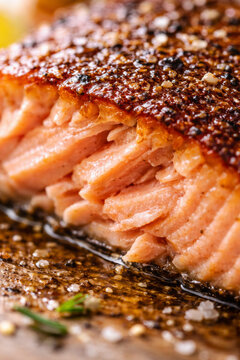 Close-up of perfectly cooked salmon fillet with crispy skin
