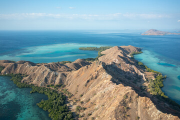 Aerial view of Pulau Siaba Besar island on a sunny tropical day © Hector