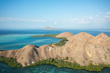 Aerial view of Pulau Siaba Besar island on a sunny tropical day © Hector