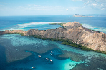 Aerial view of Pulau Siaba Besar island on a sunny tropical day © Hector