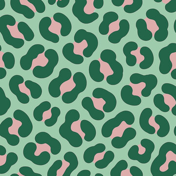 Seamless leopard pattern with green spots and soft pink accents on a light background. Modern EPS-style design, playful and trendy, for fashion prints, textiles, branding, and decorative surfaces.