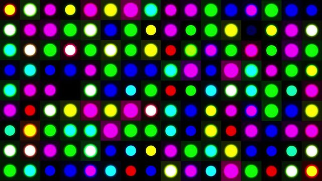 Abstract grid of randomly flashing colorful LED light dots. A dynamic mosaic of blinking circles in red, green, blue, yellow, and magenta, perfect for a retro party