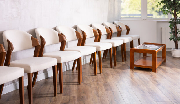 Rows of chairs in empty reception space. Business office, reception, office, waiting room, recreation area.