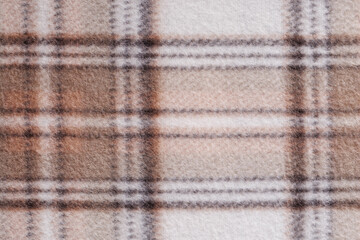 Large square plaid blanket texture in soft beige and brown shades, cozy wool textile background perfect for home comfort, winter warmth, upholstery and fashion concepts © svittlana