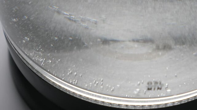 Boiling water in transparent glass kettle. Nobody
