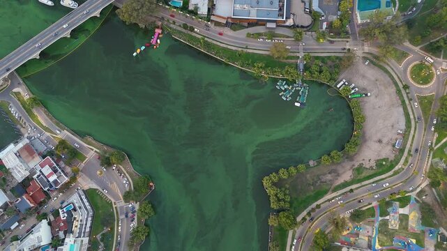 Aerial view of polluted green algae water in carlos paz argentina