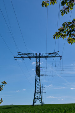 Energy Industry: Overhead high-voltage power line with a two-level anchor and a three-level dead-end tower