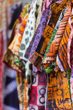Row of Colorful Patterned African Print Shirts wax print and batik pattern