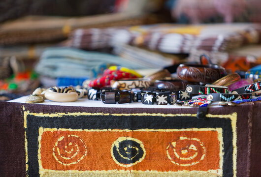 Handcrafted African Jewelry and Textiles mud cloth bogolanfini featuring geometric and spiral motifs.