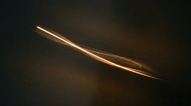Elegant amber motion blur light streak on black background, ideal for futuristic technology banners, cinematic presentation backgrounds, and sleek web design