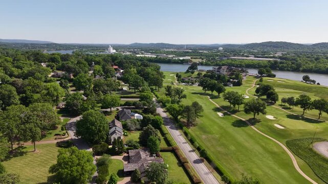 Aerial drone footage of the Riverview neighborhood in North Chattanooga, Tennessee, USA. Tree-lined residential streets, hillside homes, and scenic views near the Tennessee River. 