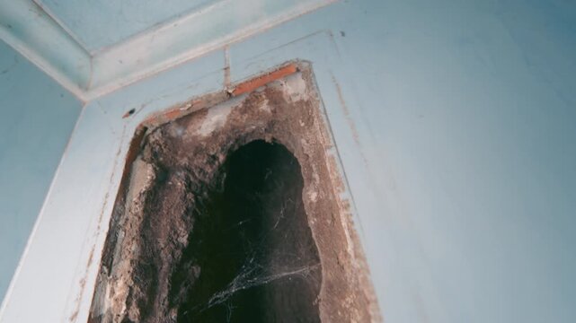 Dirty Ventilation Hole with Cobwebs Close-Up | Residential HVAC Duct Cleaning and Maintenance | Neglected Air Vent Opening in White Wall Indoor