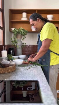 Adult man is chopping a long beans for making Indonesian east java traditional salad named pecel