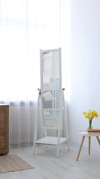 Stylish full length mirror indoors. Interior design