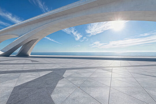This is a minimalist modern architectural coastal plaza, with smooth concrete arches framing a bright sunny view of the calm blue sea under a clear sky.