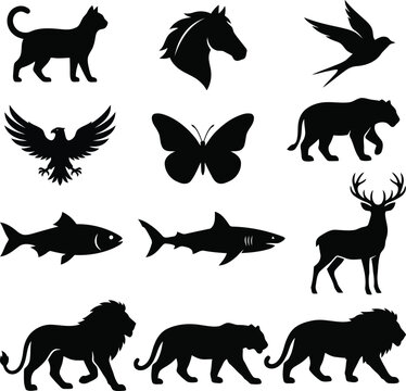 Set of black animal silhouettes including cat horse bird eagle butterfly tiger fish shark deer and lion for creative design projects