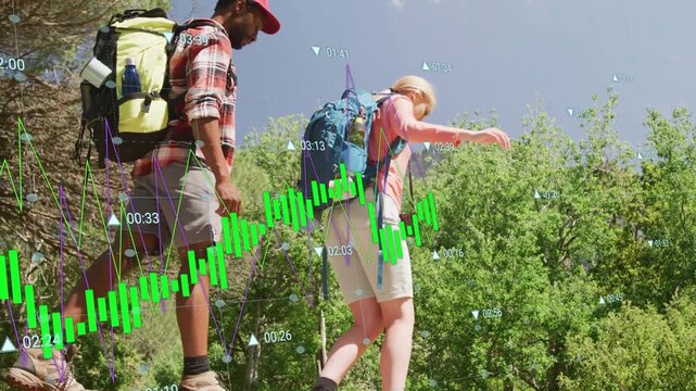 Lead hiker stepping over log, balancing, follower matching pace, green chart tracking hikers' times