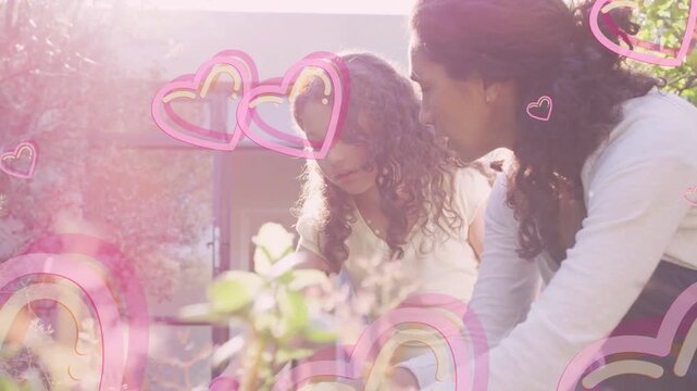 Woman leaning and pointing triggers girl reaching planter for gardening, pink hearts drifting