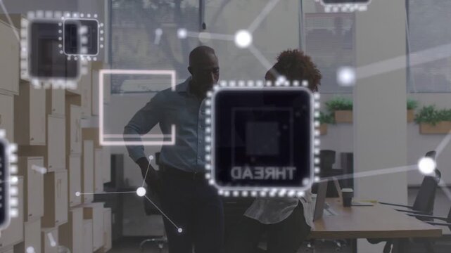Woman leaning on desk pointing at laptop starting moving node overlay mgr listening for tech review