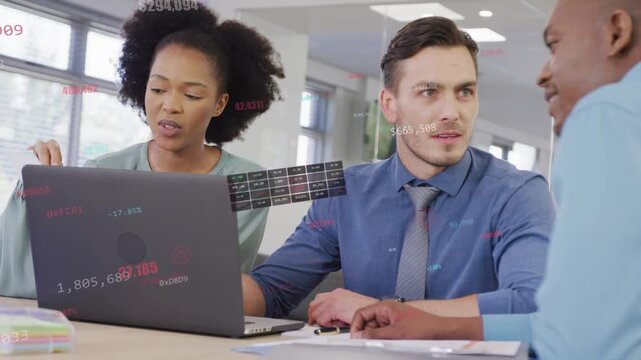 Three coworkers pointing and reviewing finance data by laptop, right speaker sparking chart overlay