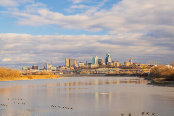 Fototapeta premium The skyline of Kansas City rises above the Missouri River.