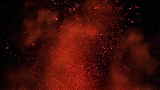 Red particles on black background.