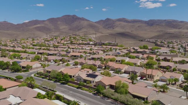 Aerial Forward Shot of Henderson Nevada Suburban Homes Near Desert Mountains