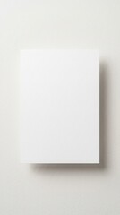 Fototapeta premium blank white paper, minimalist card mockup, vertical paper sheet, clean stationary design, empty white page, soft shadow effect, plain white background, simple document template, artistic paper display