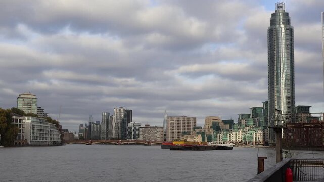 View of Canary Wharf business district in London from across the River Thames. Unique skyscrapers in England. Central business financial district.
