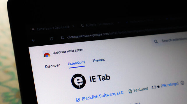 Closeup of a laptop screen showing the chrome web store page for the ie tab extension by blackfish software, llc