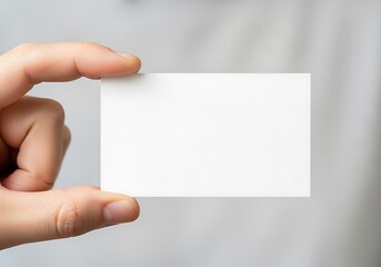 Obraz premium Hand Holding Blank White Business Card Mockup for Presentation