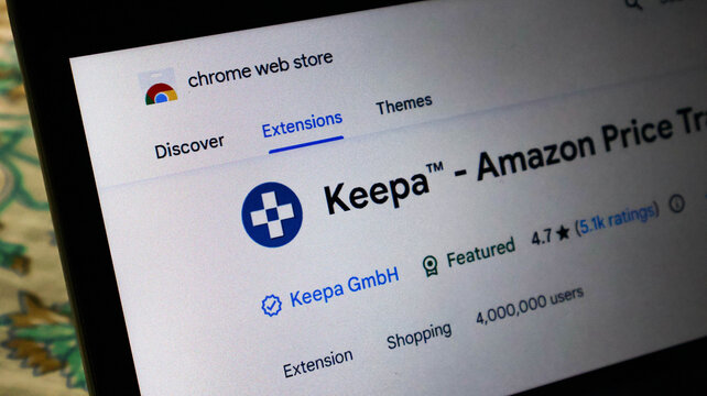 Closeup of a laptop screen showing the keepa amazon price tracker extension page on the google chrome web store with user ratings and count