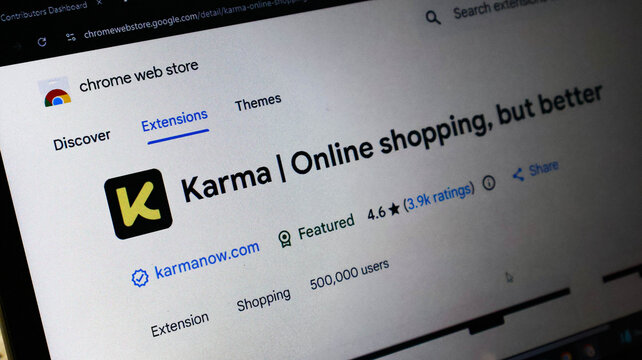Closeup of a laptop screen displaying the karma online shopping browser extension page on the google chrome web store