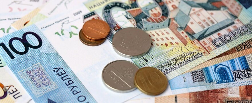 Belarusian ruble money bills and coins on table. Belarus cash of BYN currency close up