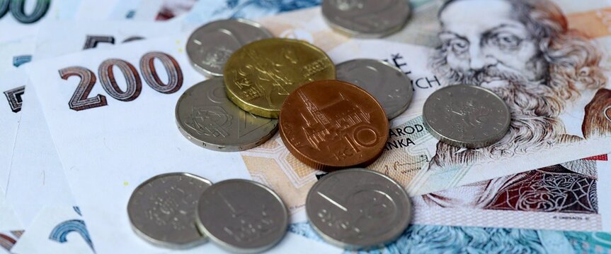 Czech koruna money bills and coins on table. Czech Republic cash of CZK currency close up