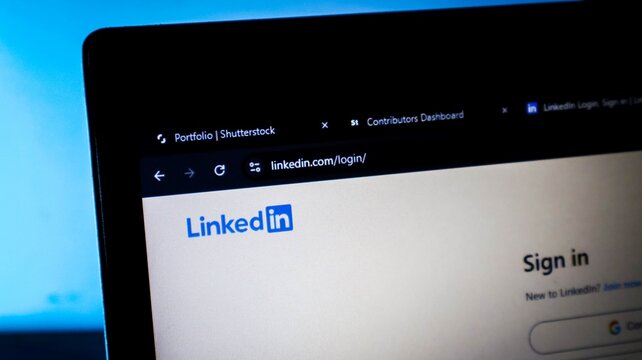 Linkedin login page displayed on a laptop screen with browser tabs open, social media networking and professional business concept