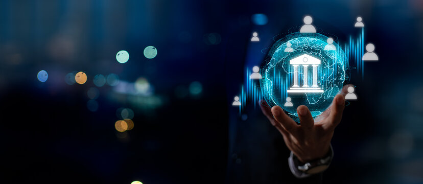 Businessman holding digital bank icon with financial data interface, concept of online banking service,digital payments,online transactions,secure money transfer,financial technology in global economy