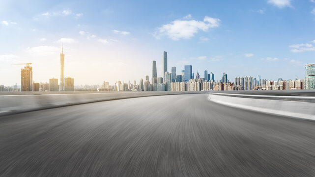 Empty Highway Overlook With Modern City Skyline View