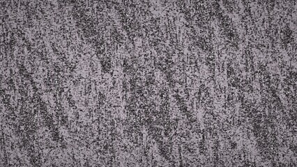 Fototapeta premium Abstract gray textured background with grainy speckled pattern resembling static noise or metallic surface. Perfect for overlays, backgrounds, and digital design projects requiring texture.