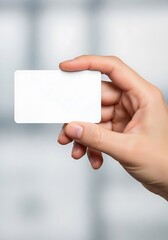 Obraz premium Person Holding a Blank White Business Card Mockup