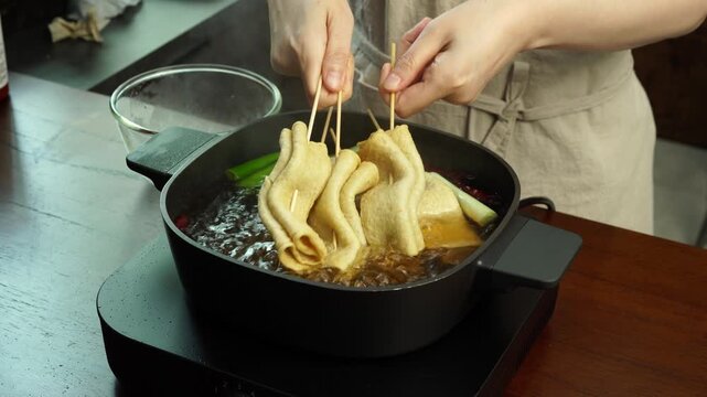 Adding Fish Cake Skewers to Boiling Broth &ndash; Korean Street Food Close Up 4K