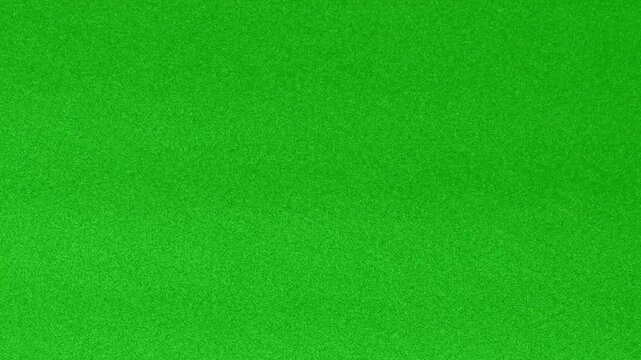Seamless green screen background with organic film grain noise