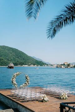 Tranquil coastal wedding setup featuring flowers and ocean views