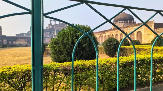 Fort garden with Solah Khambah masjid and Tarkash Mahal at bidar, karnataka, india. day time, trucking shot, hand held shot, 4k.