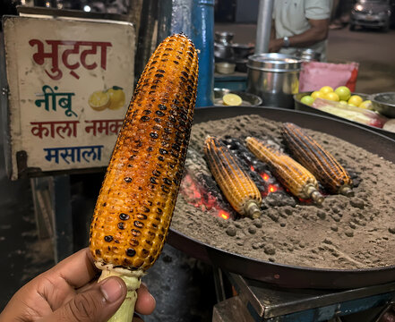 Roasted Corn on the Cob Street Food with Lemon and Black Salt at Night Market