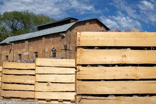 Large wooden crates containing stone paving blocks