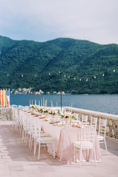 Intimate banquet arranged with floral decor and mountain backdrop